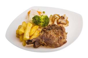 T-bone steak on the plate and white background photo