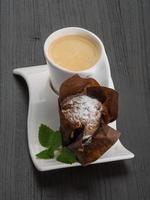 Coffee with muffin on wooden background photo