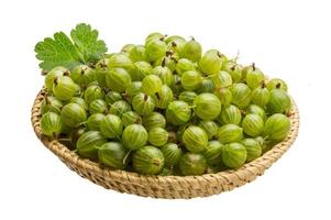 Gooseberry in a basket on white background photo