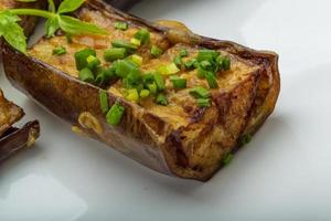 Grilled eggplant on the plate close up view photo