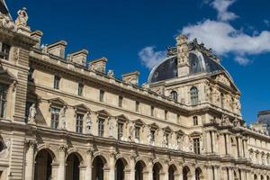 PARIS - JUNE 7 - Louvre building on June 7, 2012 in Louvre Museum, Paris, France. With 8.5m annual visitors, Louvre is consistently the most visited museum worldwide. photo