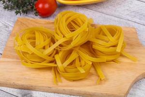 Raw pasta fettuccini photo