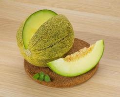 Melon on wooden background photo