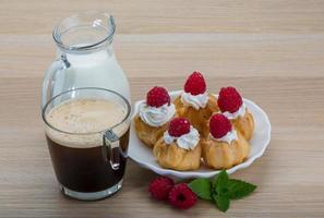 Profiterole with raspberry photo