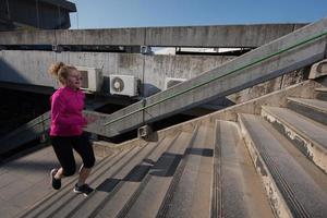 woman jogging on  steps photo