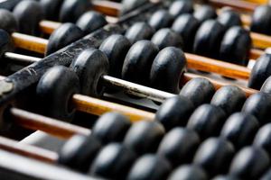 Vintage wooden abacus isolated on white photo