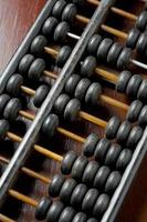 Vintage wooden abacus on the table photo