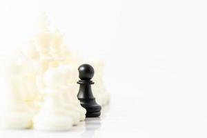 Set of Black and white chess pieces on white background photo