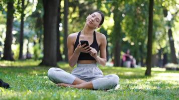 Yoga Girl At The Park Uses Phone video