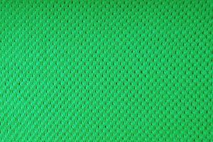 fondo de textura de tela de lana de punto verde brillante. telón de fondo textil abstracto foto