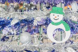 Snowman and tinsel  holiday background photo