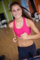 woman exercising on treadmill in gym photo