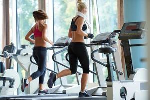 woman exercising on treadmill in gym photo