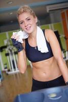 woman exercising on treadmill in gym photo