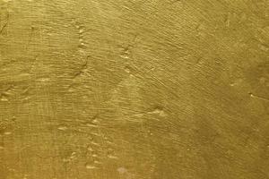 textura de pared de hormigón de oro abstracto. dorado sobre fondo de pared de cemento para telón de fondo o diseño foto