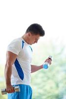 man exercise with weights photo