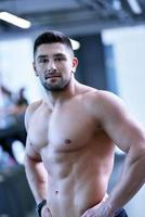 handsome man exercising at the gym photo