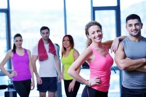 Group of people exercising at the gym photo