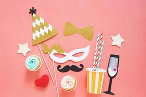 Cute party props, cakes on colorful background, happy new year party celebration and holiday concept photo