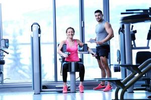 woman exercising with her personal trainer photo