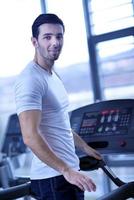 man running on the treadmill photo