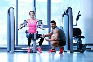 woman exercising with her personal trainer photo