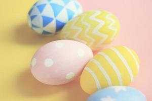 Pastel and colorful cute easter eggs with on colorful background photo