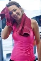 woman exercising on treadmill in gym photo