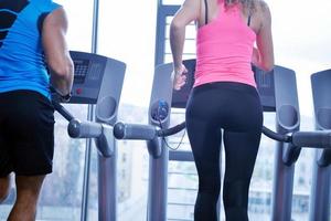 Group of people running on treadmills photo