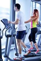 Group of people running on treadmills photo