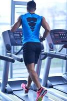 man running on the treadmill photo