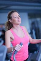 woman exercising on treadmill in gym photo