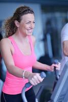 woman exercising on treadmill in gym photo