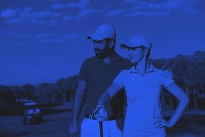 portrait of couple on golf course photo