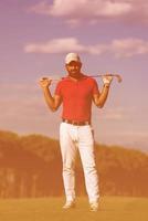 handsome middle eastern golf player portrait at course photo