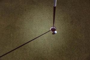 top view of golf ball in the hole photo