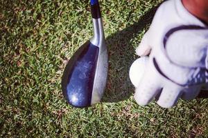 golf club and ball in grass photo