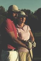 portrait of couple on golf course photo