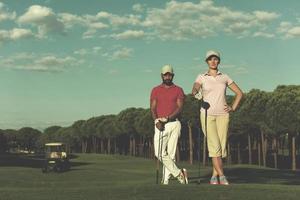 portrait of couple on golf course photo