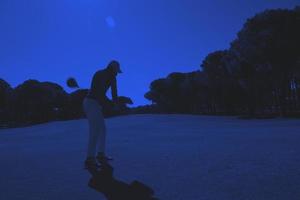 golf player hitting shot photo