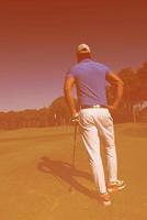 retrato de jugador de golf desde atrás foto