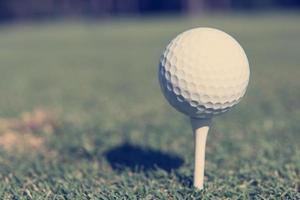 golf ball on tee photo