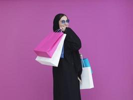 Happy muslim girl posing with shopping bags photo