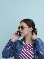 Portrait of young girl talking on the phone photo