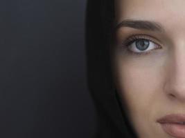 Portrait of modern young muslim woman in black abaya photo