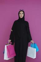 Happy muslim girl posing with shopping bags photo