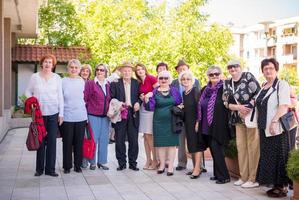 group portrait of senior people with geriatric nurse photo