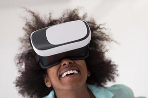 black girl using VR headset glasses of virtual reality photo