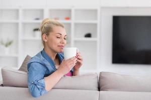 woman enjoying a cup of coffee photo