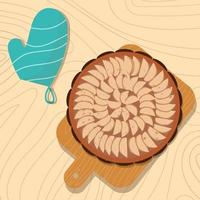 Apple pie on a wooden table and with potholder vector